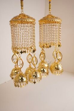 Traditional South Asian bridal wrist jewelry with jhumka details