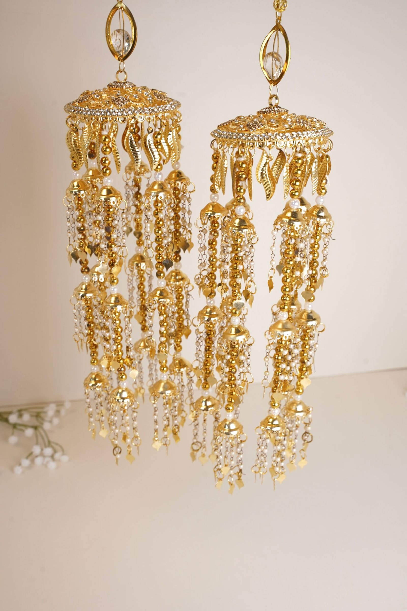 Close-up of gold kaleerey with tiny pearls and leaves