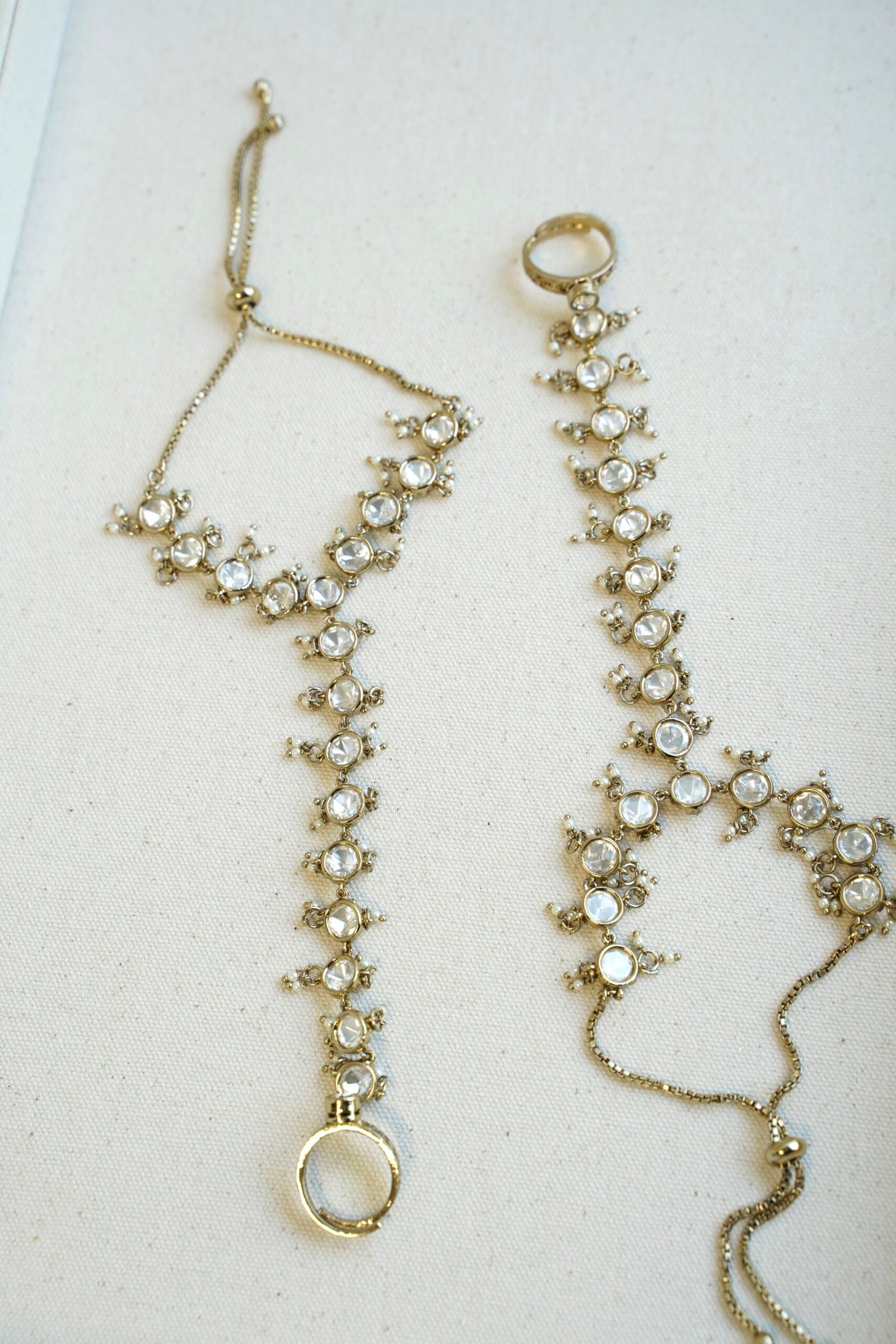 Seyora Jewels traditional Kundan hathphool hand harness set for both hands, featuring gold plating and white stones