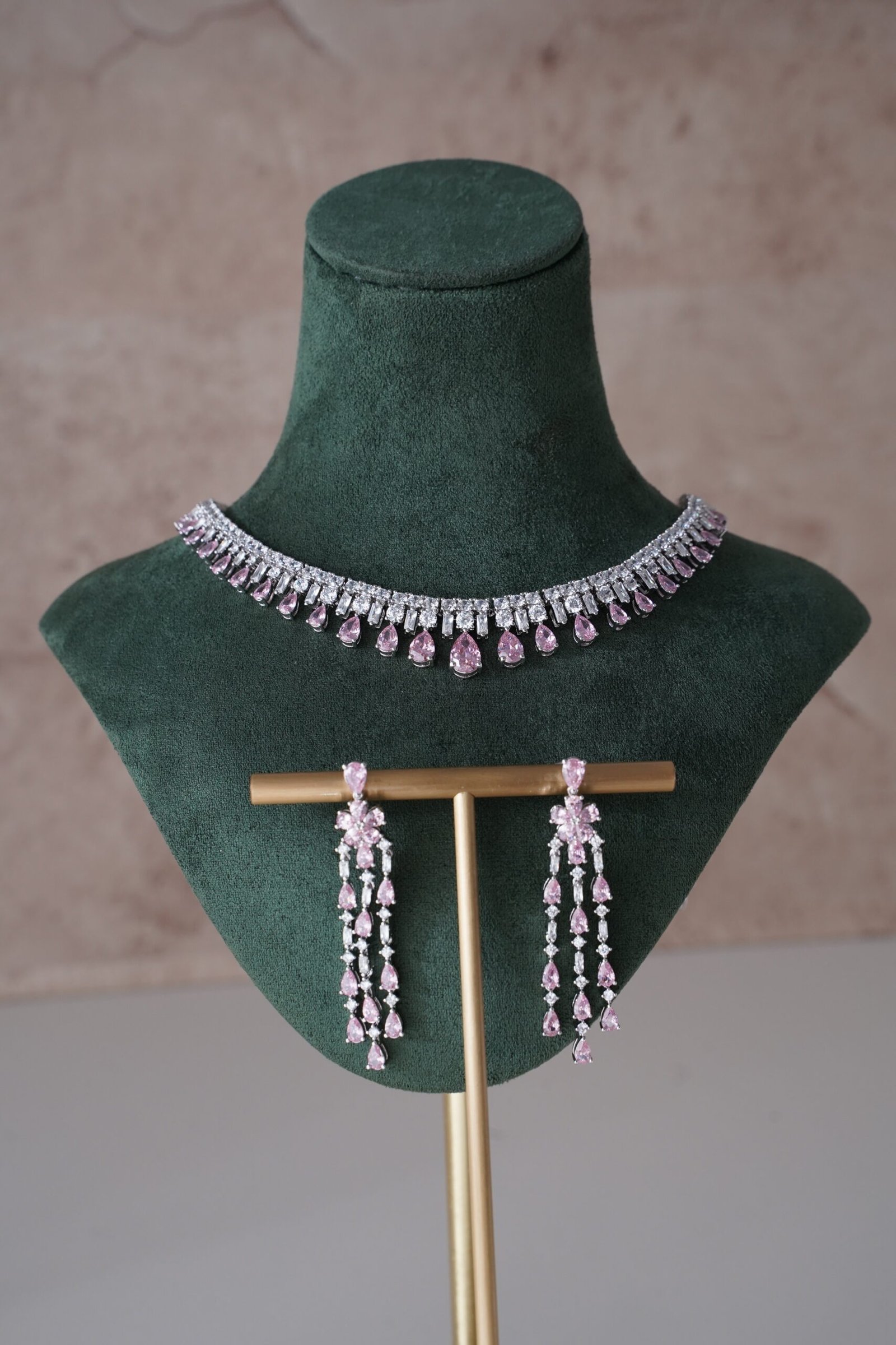 Delicate pink American diamond necklace set with matching earrings, featuring sparkling stones in a soft feminine design