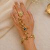 Adjustable gold haathphool hand jewelry with intricate ethnic design, perfect for Indian and Pakistani bridal wear