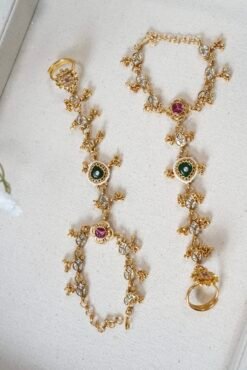 Adjustable gold haathphool hand jewelry with intricate ethnic design, perfect for Indian and Pakistani bridal wear
