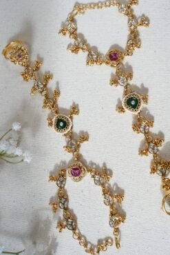 Adjustable gold haathphool hand jewelry with intricate ethnic design, perfect for Indian and Pakistani bridal wear