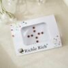 Classic matte maroon round bindi for traditional South Asian styling.