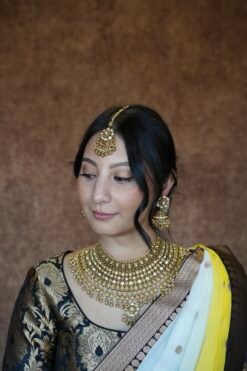 Sawrnika kundan bridal set with matte finish and matching jhumka earrings and tikka - South Asian bridal jewelry