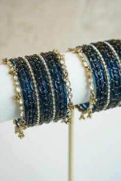 Blue glass bangle stack with delicate ghungroo accent bangles for weddings, mehendi events, and festive wear.
