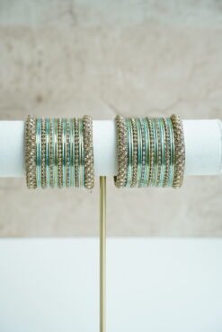 Blue metal bangle stack featuring statement kata bangles on each end, perfect for summer weddings and festive occasions.