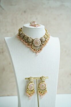 Lightweight pink artificial Kundan necklace set with matching drop earrings and Maang Tikka for South Asian weddings.