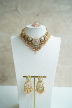 Lightweight pink artificial Kundan necklace set with matching drop earrings and Maang Tikka for South Asian weddings.