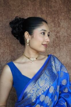 Dainty mini Kundan necklace with an adjustable chain and a pair of matching classic earrings by Seyora Jewels.