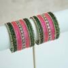 green and pink glass bangle stack with statement kundan centerpiece bangles for weddings and festive wear.
