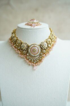 Lightweight pink artificial Kundan necklace set with matching drop earrings and Maang Tikka for South Asian weddings.