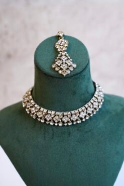 Indian Pakistani necklace set with matching sparkly drop earrings and traditional maang tikka for bridal receptions and festive events.