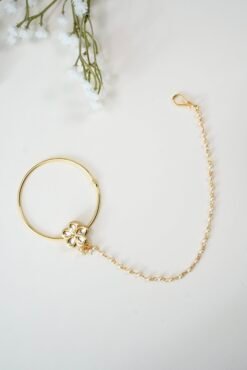 Oversized 5.5 cm bridal Kundan nath with a brilliant bright gold polish and traditional stones by Seyora Jewels.