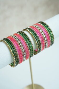 green and pink glass bangle stack with statement kundan centerpiece bangles for weddings and festive wear.