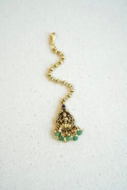 Traditional temple style tikka with elegant green bead accents for bridal, festive, and cultural wear.