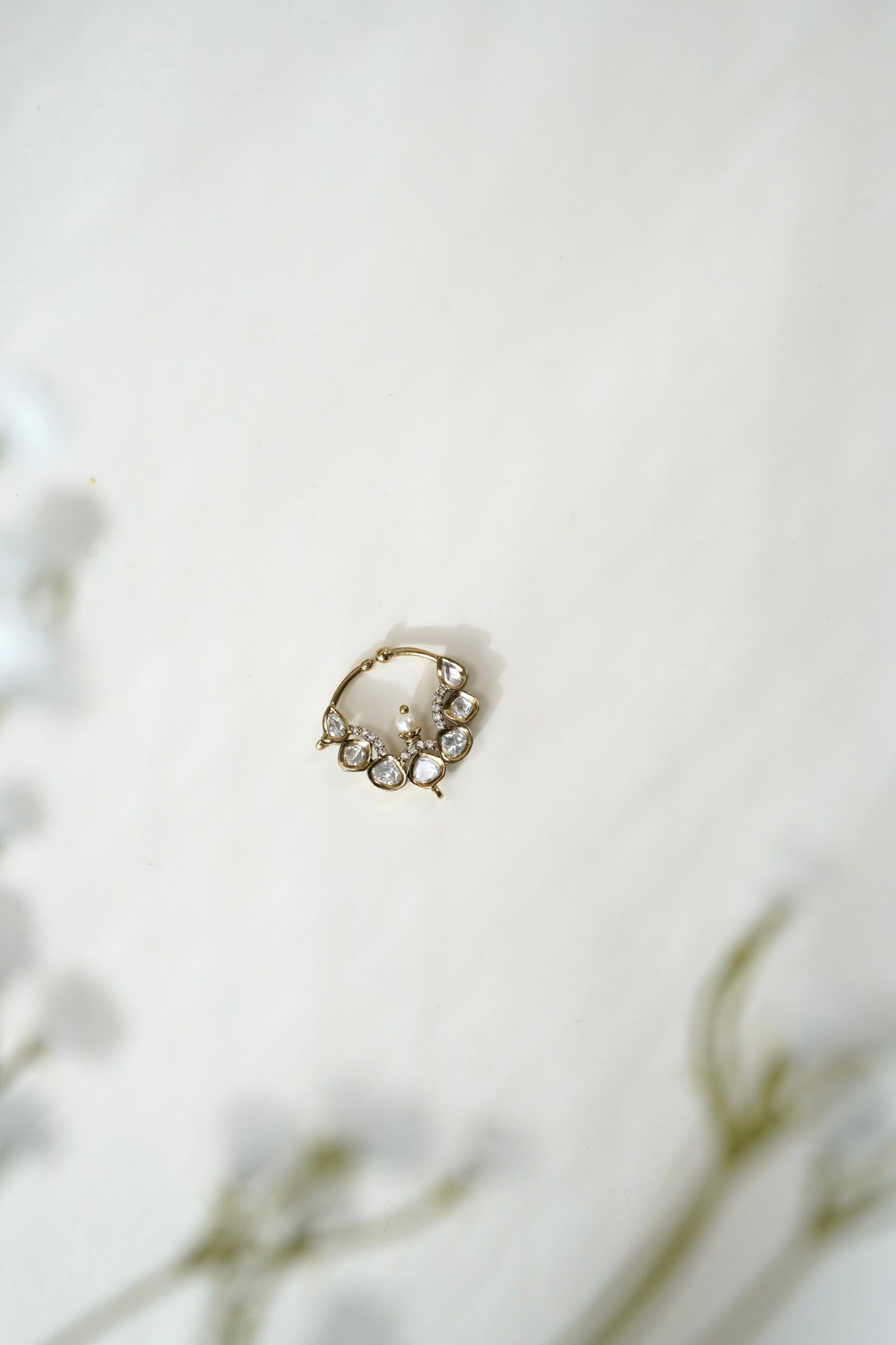 Traditional Kundan nath with a dark antique mehndi finish polish and classic stone detailing by Seyora Jewels.