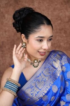 Elegant green beaded choker necklace and matching earrings featuring a lotus Kundan centerpiece by Seyora Jewels.