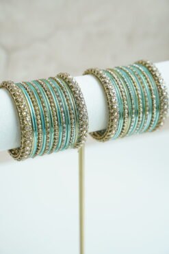 Blue metal bangle stack featuring statement kata bangles on each end, perfect for summer weddings and festive occasions.