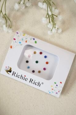 Multi color bindis with matching color stone settings.