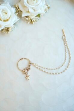 Dainty gold polish Kundan nath featuring a sparkly tiny zircon set, floral details, and a two-layer micro-beaded chain by Seyora Jewels.