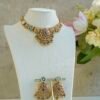 Heritage necklace set with pink green stones and mother of pearl accents in yellow gold finish with matching earrings