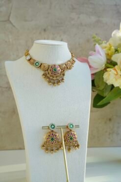 Heritage necklace set with pink green stones and mother of pearl accents in yellow gold finish with matching earrings
