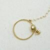 Oversized oval Kundan nath featuring a matte gold finish and a single-layer sleek chain by Seyora Jewels.