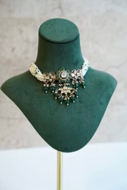 Elegant green beaded choker necklace and matching earrings featuring a lotus Kundan centerpiece by Seyora Jewels.