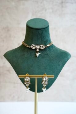 Dainty mini Kundan necklace with an adjustable chain and a pair of matching classic earrings by Seyora Jewels.