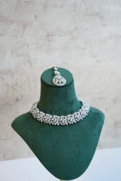 Delicate silver-plated petite stone necklace set with matching sparkly drop earrings and small pendant tikka.