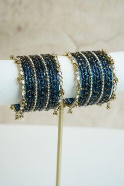 Blue glass bangle stack with delicate ghungroo accent bangles for weddings, mehendi events, and festive wear.