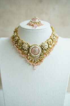 Lightweight pink artificial Kundan necklace set with matching drop earrings and Maang Tikka for South Asian weddings.