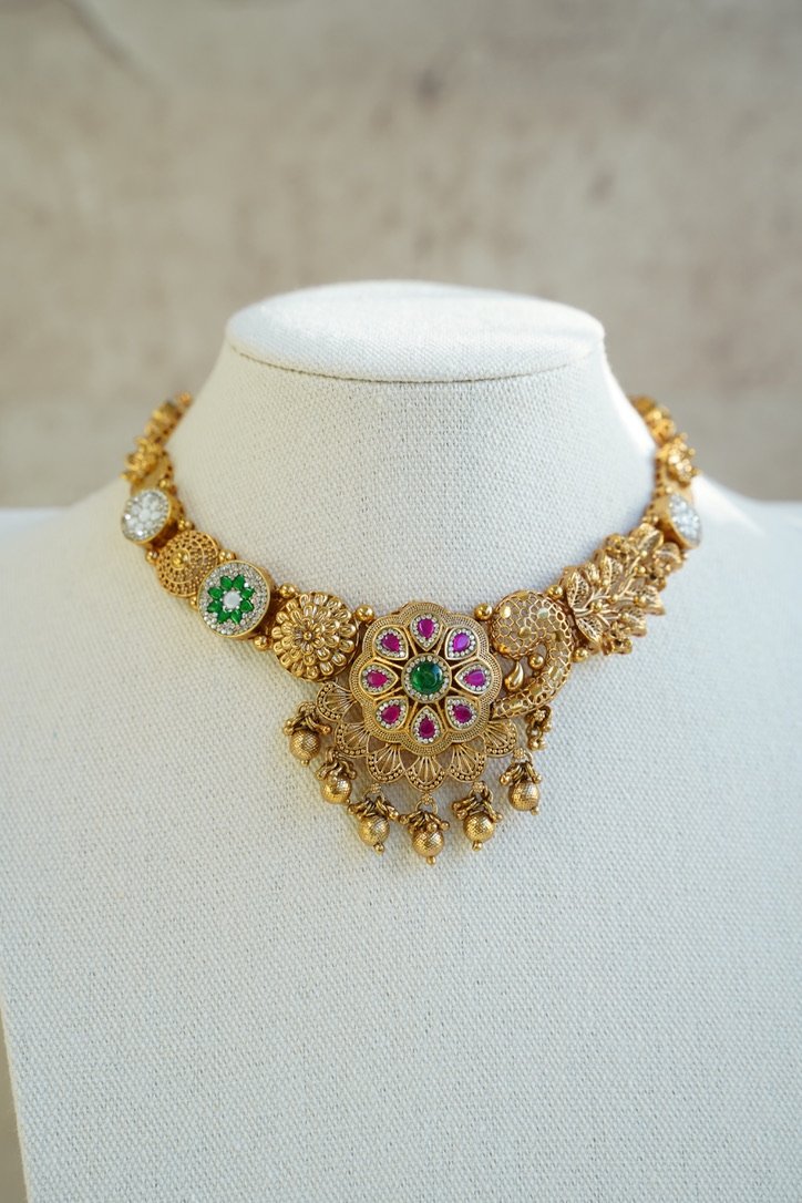 Heritage necklace set with pink green stones and mother of pearl accents in yellow gold finish with matching earrings