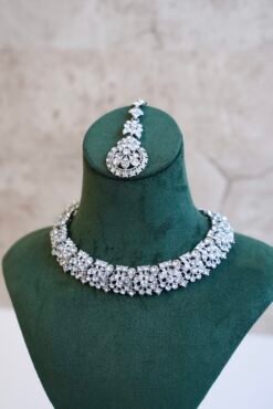 Delicate silver-plated petite stone necklace set with matching sparkly drop earrings and small pendant tikka.