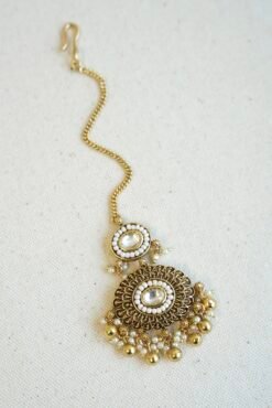 Traditional kundan tikka with elegant golden bead detailing for bridal, wedding, and festive wear.