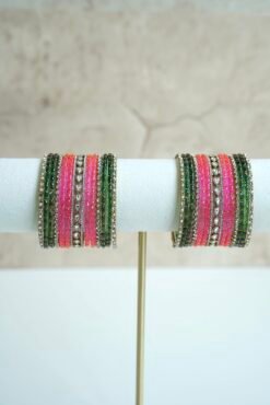 green and pink glass bangle stack with statement kundan centerpiece bangles for weddings and festive wear.