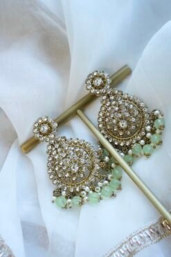 Zoya necklace set in light green with clear stones, hanging light green beads, matching earrings, and tikka