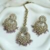 Seyora sparkling festive jewelry set featuring clear stone earrings with hanging crystal beads and a matching maang tikka.