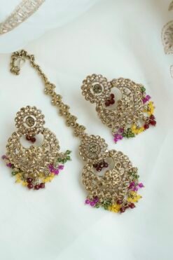 Seyora sparkling festive jewelry set featuring champagne stone earrings with hanging multi-color crystal beads and a matching maang tikka.
