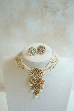 Seyora Jewels modern pachi kundan beaded choker necklace featuring a 3.5-inch floral centerpiece with hanging beads and matching square floral earrings.