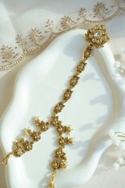 Seyora Jewels Diya floral Kundan hathpan hand chain featuring a kundan-studded flower ring and a detailed connecting chain linked to an adjustable wrist strap.