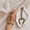 Seyora Jewels Sia traditional floral hathpan hand chain featuring an adjustable flower ring and a structured bracelet-style wrist band.