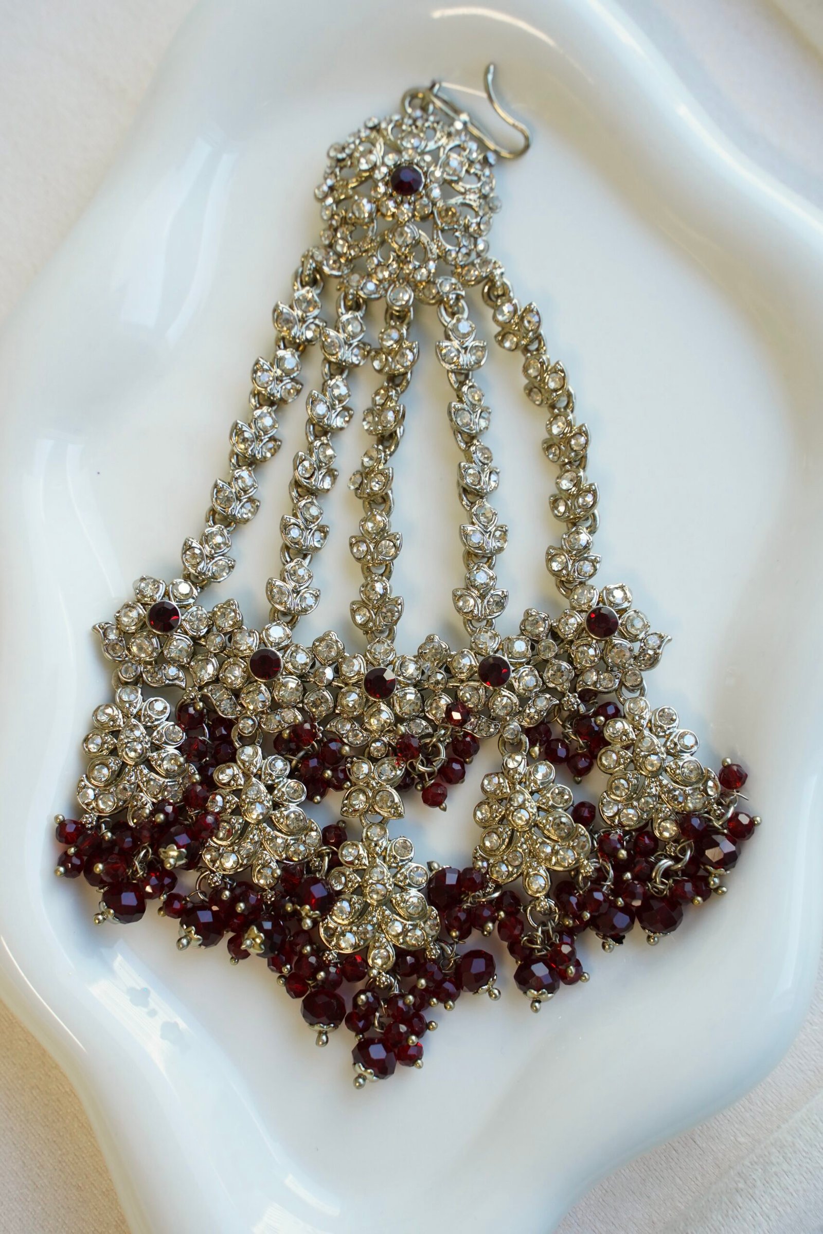 Ayesha crystal beaded bridal set in maroon with double layer necklace, jhumar, kaanchain, and tikka, South Asian wedding jewelry