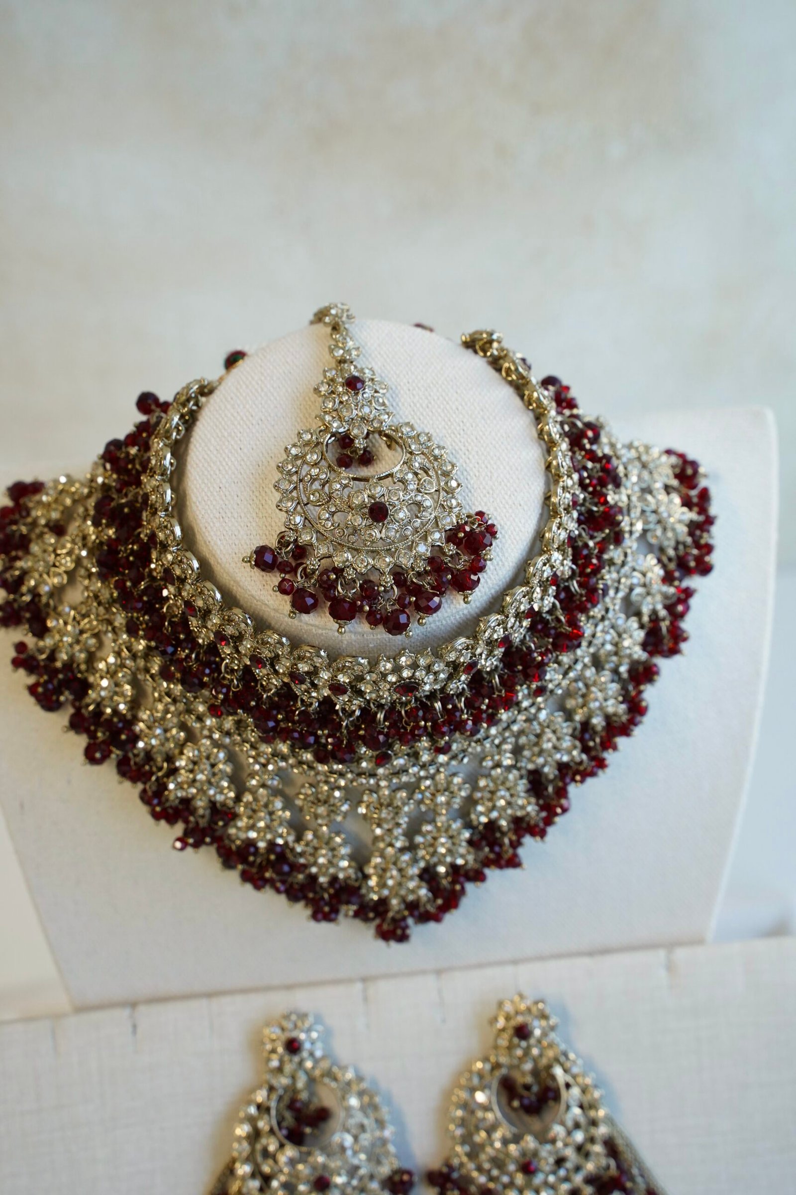 Ayesha crystal beaded bridal set in maroon with double layer necklace, jhumar, kaanchain, and tikka, South Asian wedding jewelry