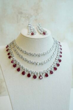 Luxe AD layered necklace set with maroon and clear stone detailing, South Asian bridal jewelry