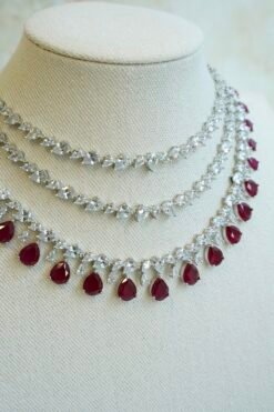 Luxe AD layered necklace set with maroon and clear stone detailing, South Asian bridal jewelry