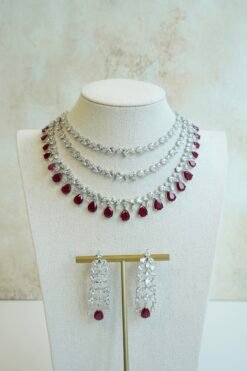 Luxe AD layered necklace set with maroon and clear stone detailing, South Asian bridal jewelry