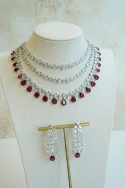 Luxe AD layered necklace set with maroon and clear stone detailing, South Asian bridal jewelry
