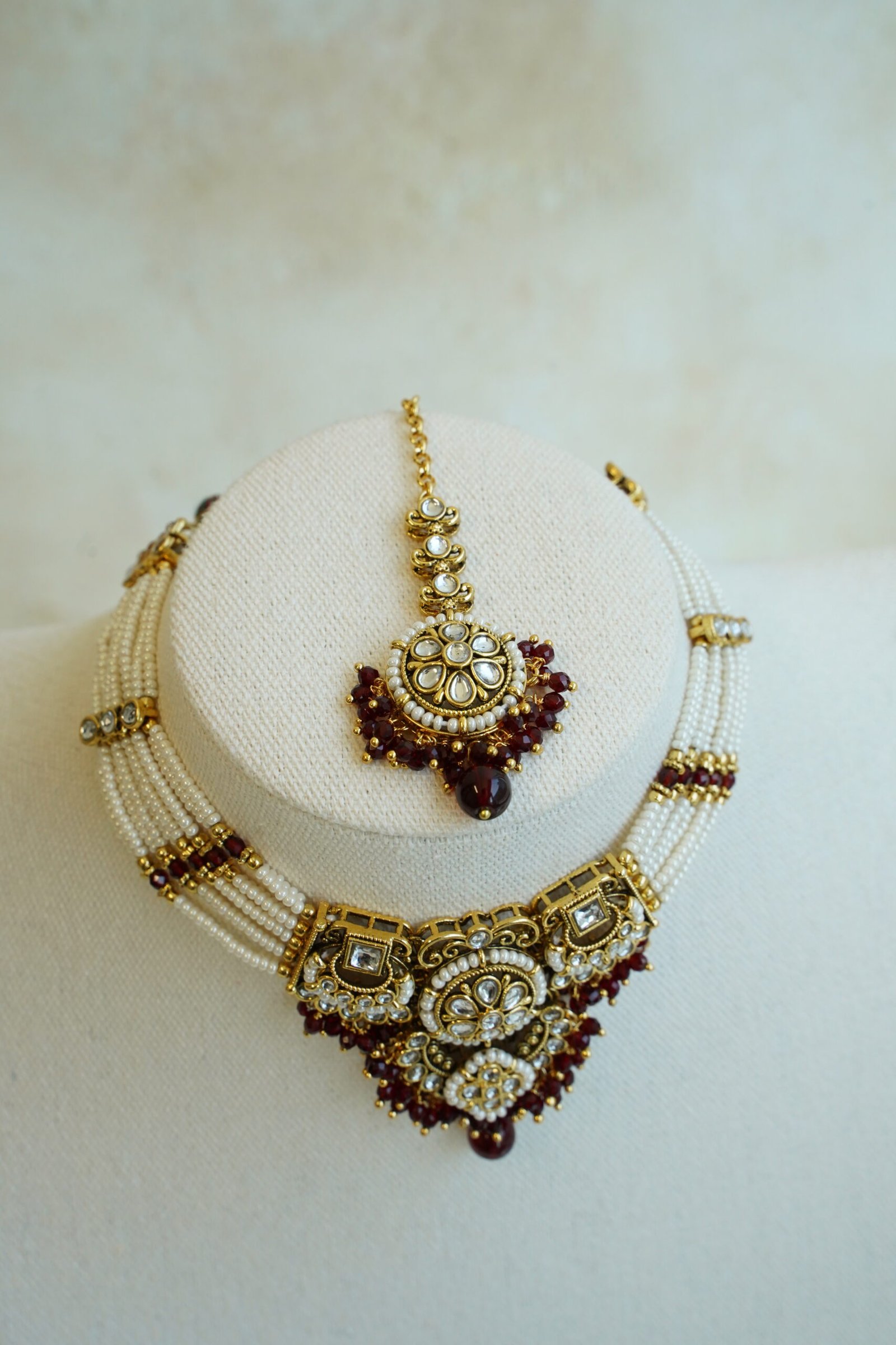 Riya artificial kundan necklace set in maroon with matching jhumka earrings and tikka, South Asian festive jewelry